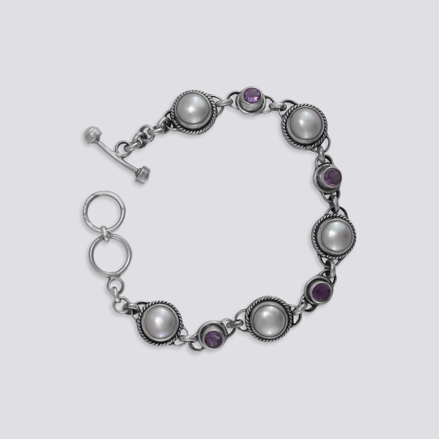 Sterling silver bracelet with amethyst and pearl