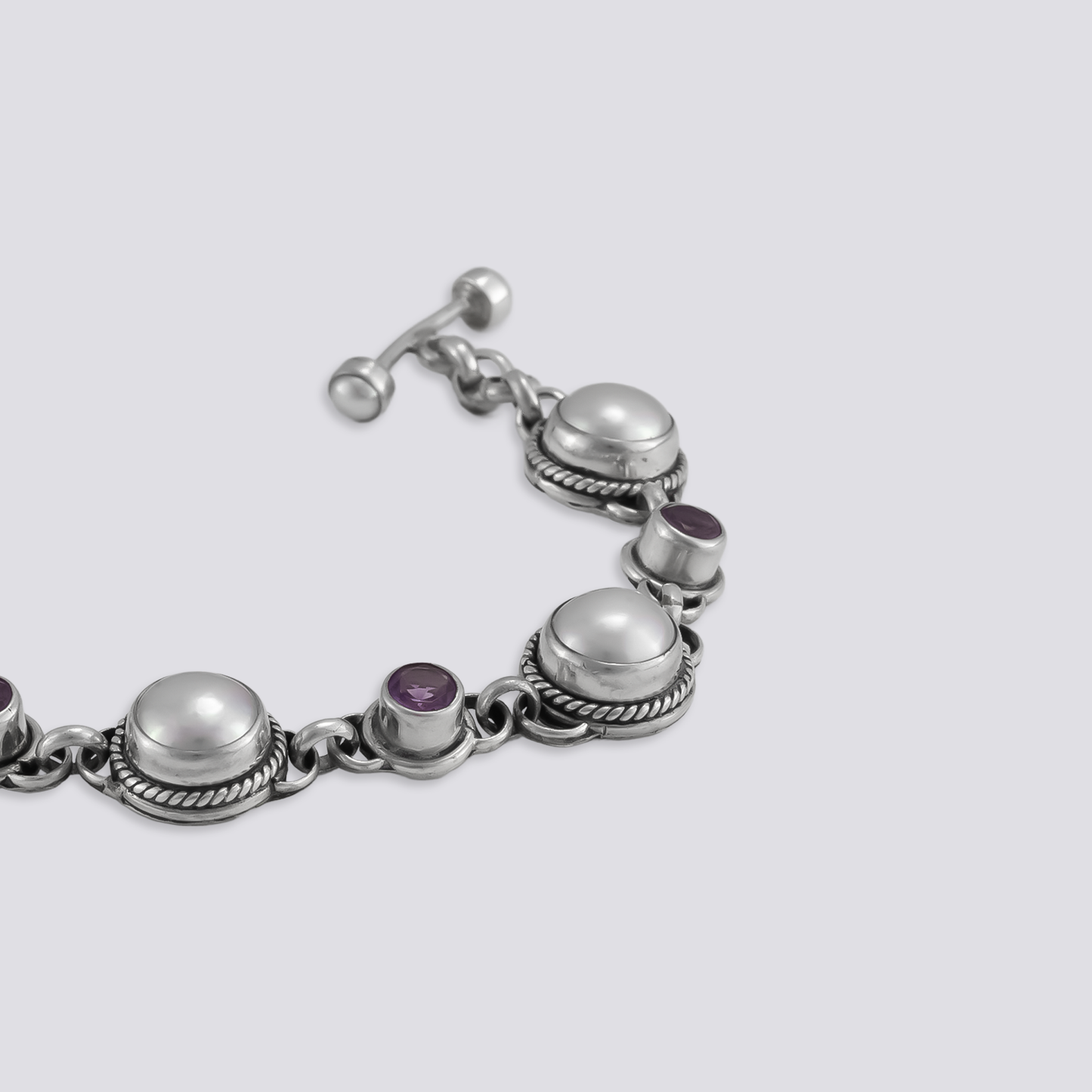 Sterling silver bracelet with amethyst and pearl