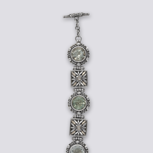 Sterling Silver bracelet with green amethyst and gold and diamonds