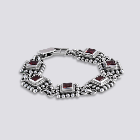 Sterling silver bracelet with red garnet