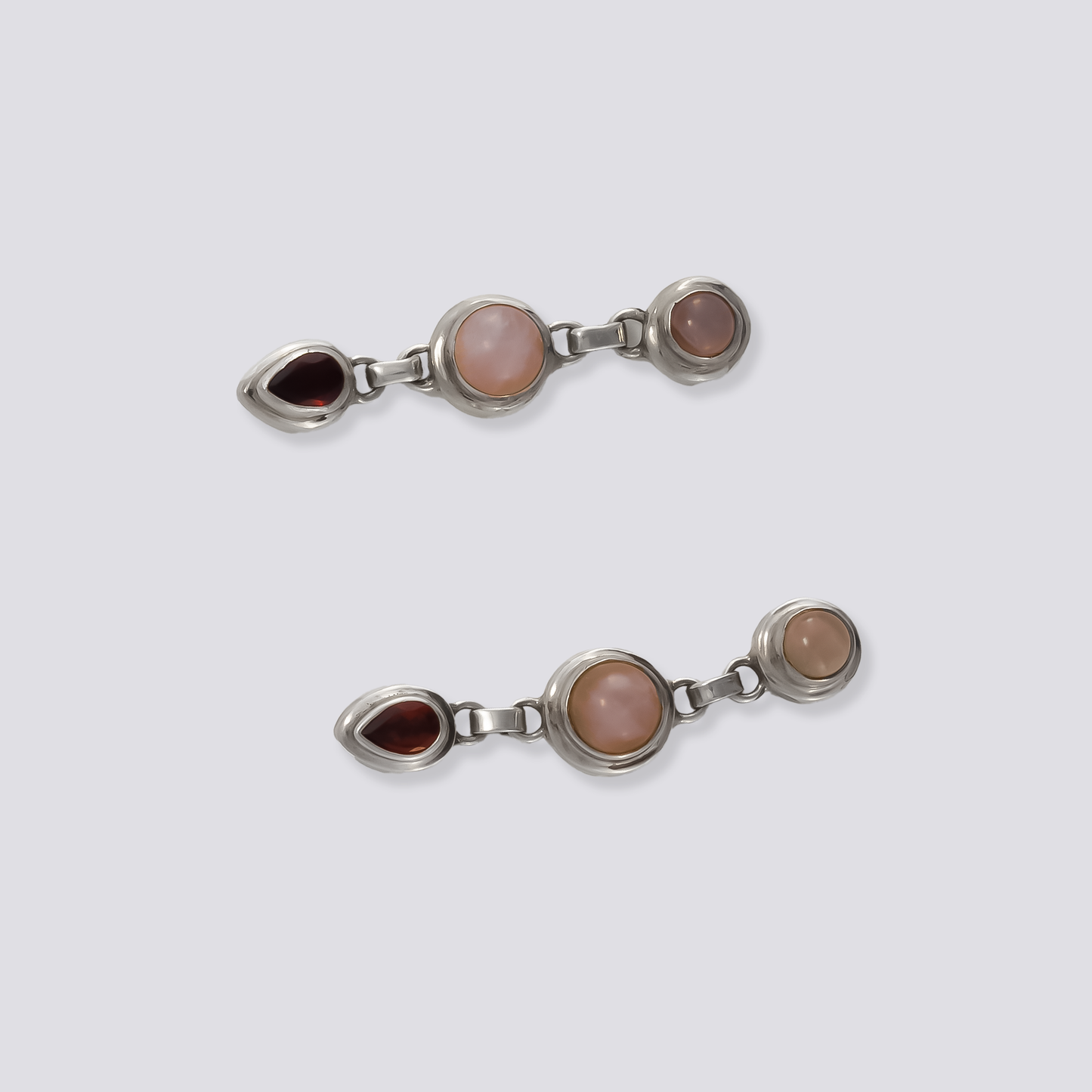 Sterling silver earrings with red garnet and white stones