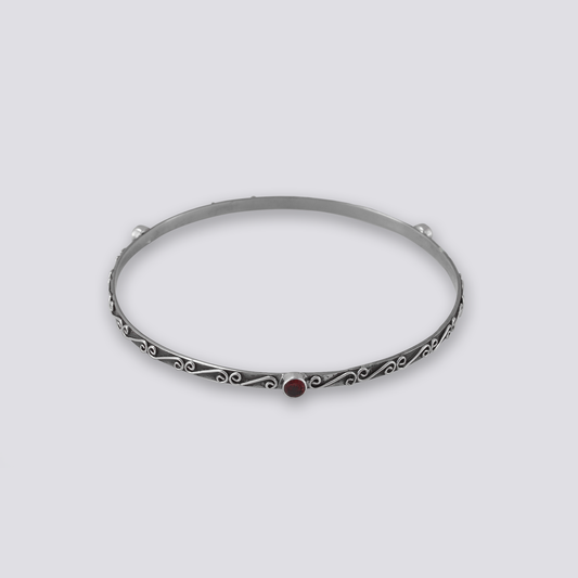 Sterling silver bangle with red garnet