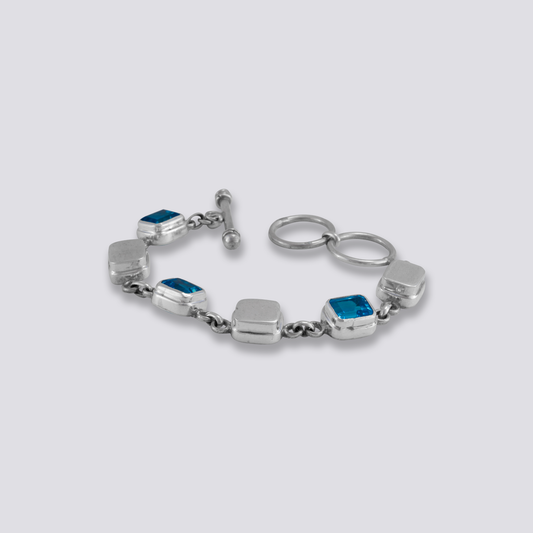 Sterling silver bracelet with blue topaz