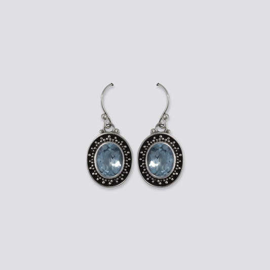 Sterling silver earrings with blue topaz stones