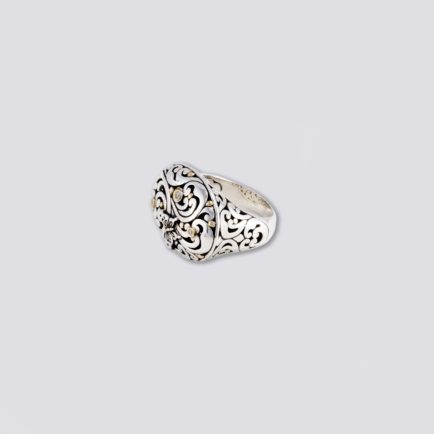 Sterling silver ring with artisan design and diamonds