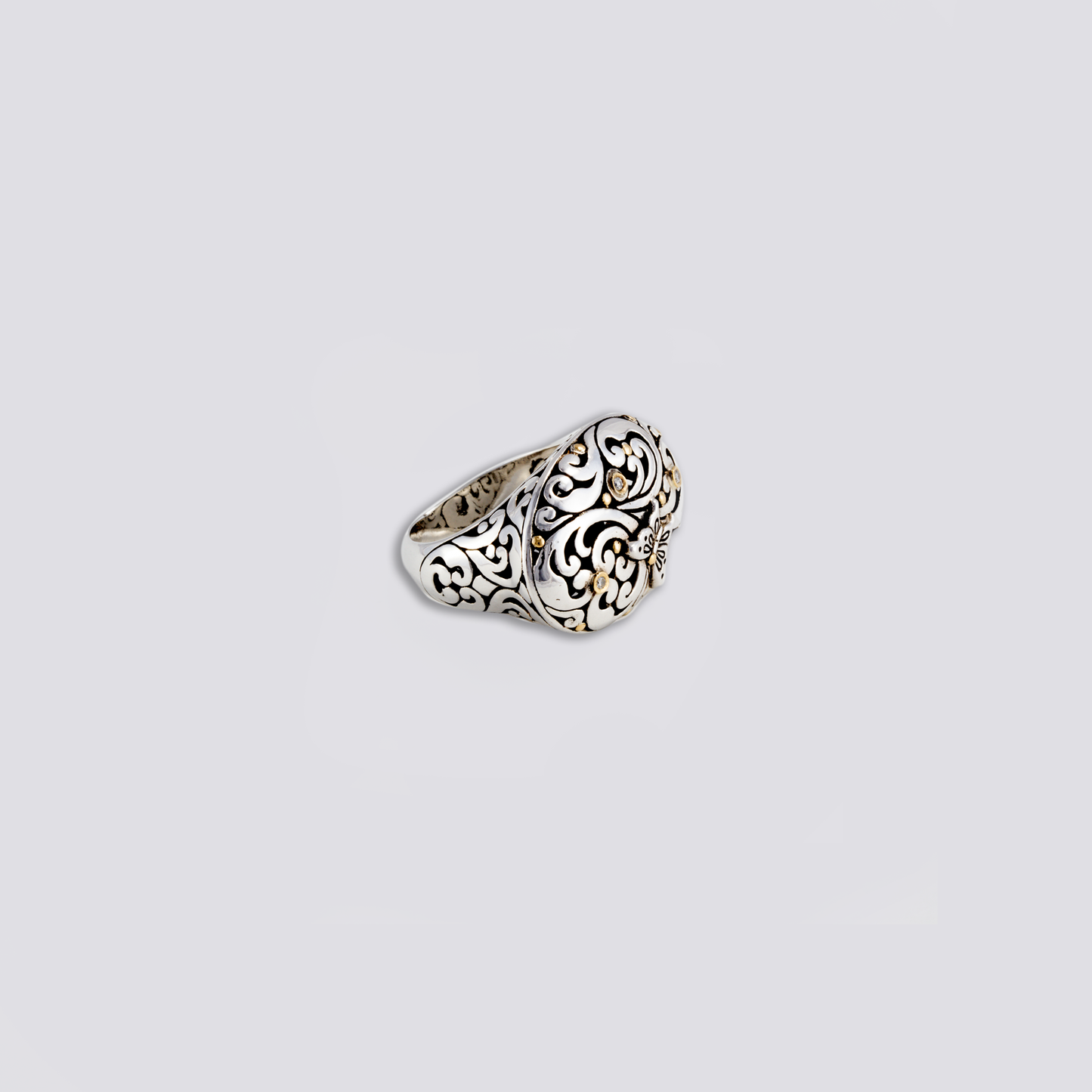 Sterling silver ring with artisan design and diamonds